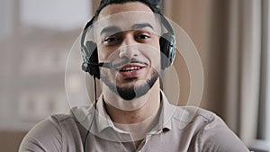 Smiling male operator hispanic businessman customer support service assistant representative greeting speak at web