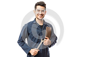 Smiling Male Repairman Holding Wrench And Clipboard