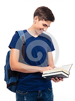 Smiling male student reading book