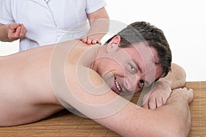 Smiling man on acupuncture treatment , horizontal portrait