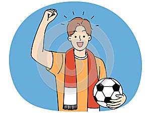 Smiling man with ball supporting at match