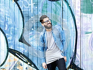 Smiling man with beard and glasses