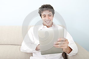 Smiling man with digital tablet