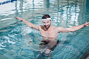 Smiling man doing underwater bike