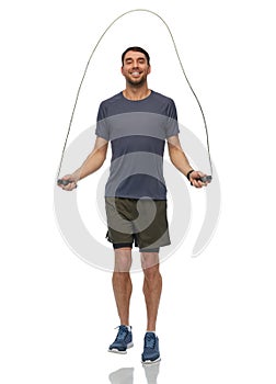 smiling man exercising with jump rope