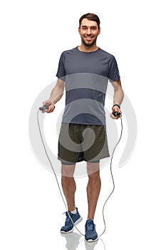 smiling man exercising with jump rope