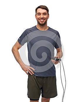 smiling man exercising with jump rope