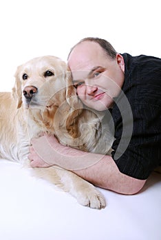 Smiling man with Golden Retriever