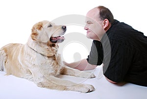 Smiling man with Golden Retriever