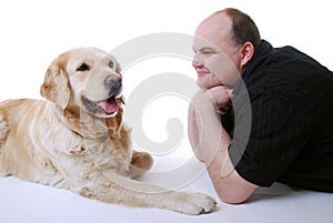 Smiling man with Golden Retriever