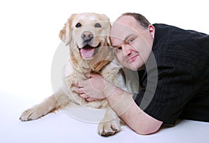 Smiling man with Golden Retriever