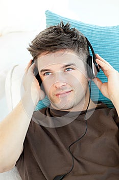 Smiling man with headphones listening to music