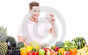 Smiling man with healthy fruit vegetable drink