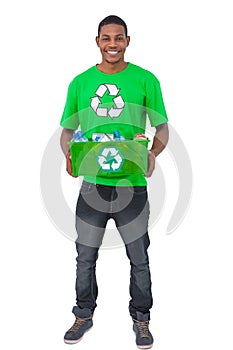 Smiling man holding box of recyclables