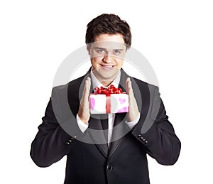 Smiling man holding present box