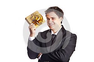 Smiling man holding present box