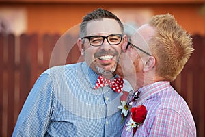 Smiling Man Kissed By Spouse