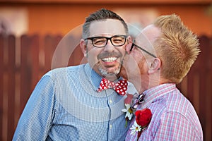 Smiling Man Kissed By Spouse photo