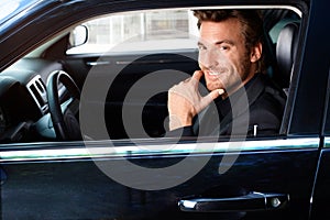 Smiling man in limousine