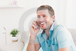 Smiling man on a phone