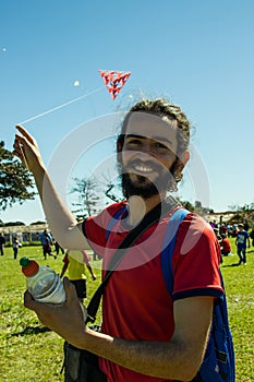 Smiling Man Playing with a Kite