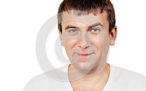 Smiling man with a raised eyebrow