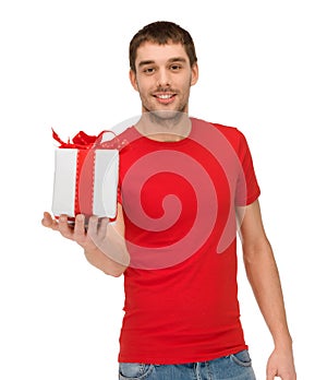 Smiling man in red shirt with gift box