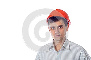 Smiling man in a shirt orange construction helmet