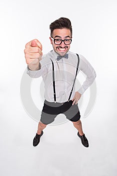 Smiling man showing middle finger