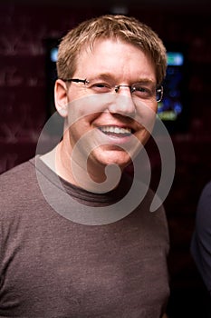 Smiling man in spectacles