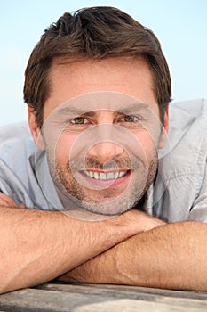 Smiling man with stubble