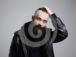 Smiling Man with stylish haircut. handsome Boy with beard