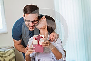 Man surprises his girlfriend with present at home photo