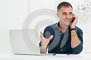 Smiling Man Talking On Cellphone