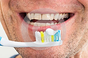 Smiling man with toothbrush