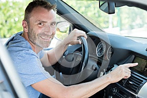 smiling man using car gps