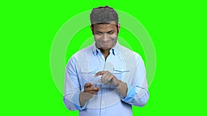 Smiling man using glass digital device.