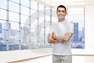 Smiling man in white t-shirt over office or home