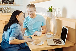 Smiling man and woman listening to music