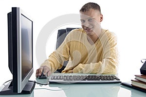 Smiling man working on computer