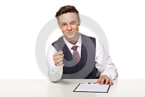 Smiling manager or businessman offers to sign a contract holding a pen and documents for signature