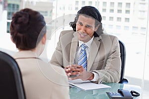 Smiling manager interviewing a female applicant