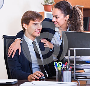 Smiling manager touching employee