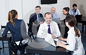 Smiling managers having a productive day in office