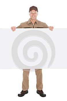 Smiling Manual Worker With Billboard