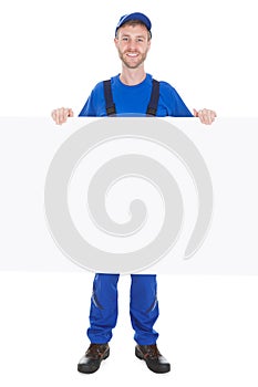 Smiling Manual Worker With Billboard