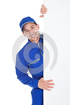 Smiling Manual Worker With Billboard