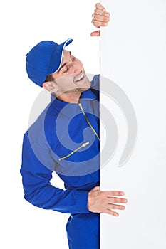 Smiling Manual Worker With Billboard