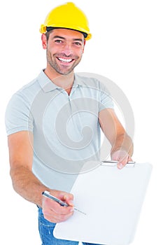 Smiling manual worker giving clipboard for signature