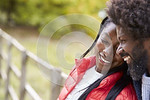 Smiling mature black couple together in the ocuntryside, close up
